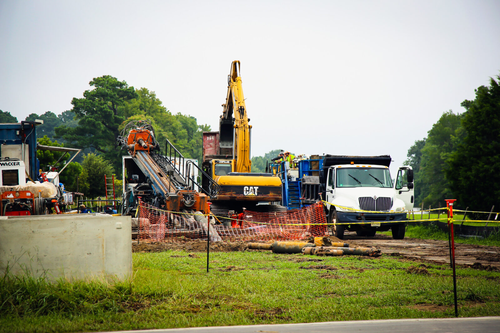 Trucks and heavy machinery staging on job site