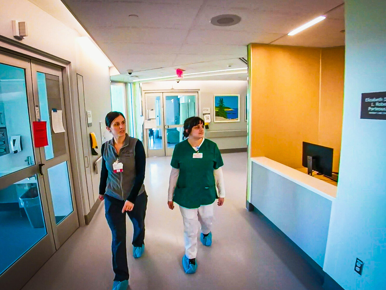 Workers from Maine Medical Center walking through a hallway