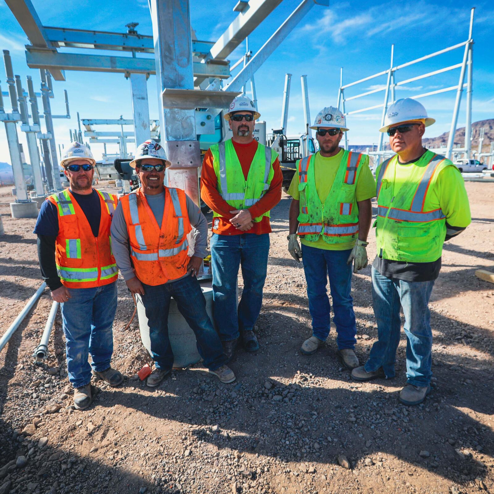 Group of workers smiling at a construction site